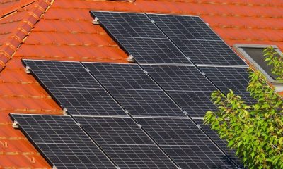 Close-up of solar panels on a red tiled roof in Croatia, highlighting renewable energy.