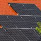 Close-up of solar panels on a red tiled roof in Croatia, highlighting renewable energy.